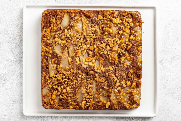 Taste of Home Pear Upside Down Cake recipe photo of the baked cake on a platter.