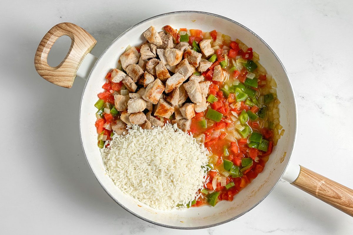 Taste of Home Pork and Rice in a white skillet