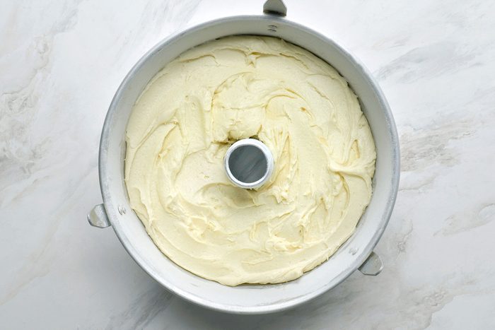 Poured mixture into a greased and floured tube pan