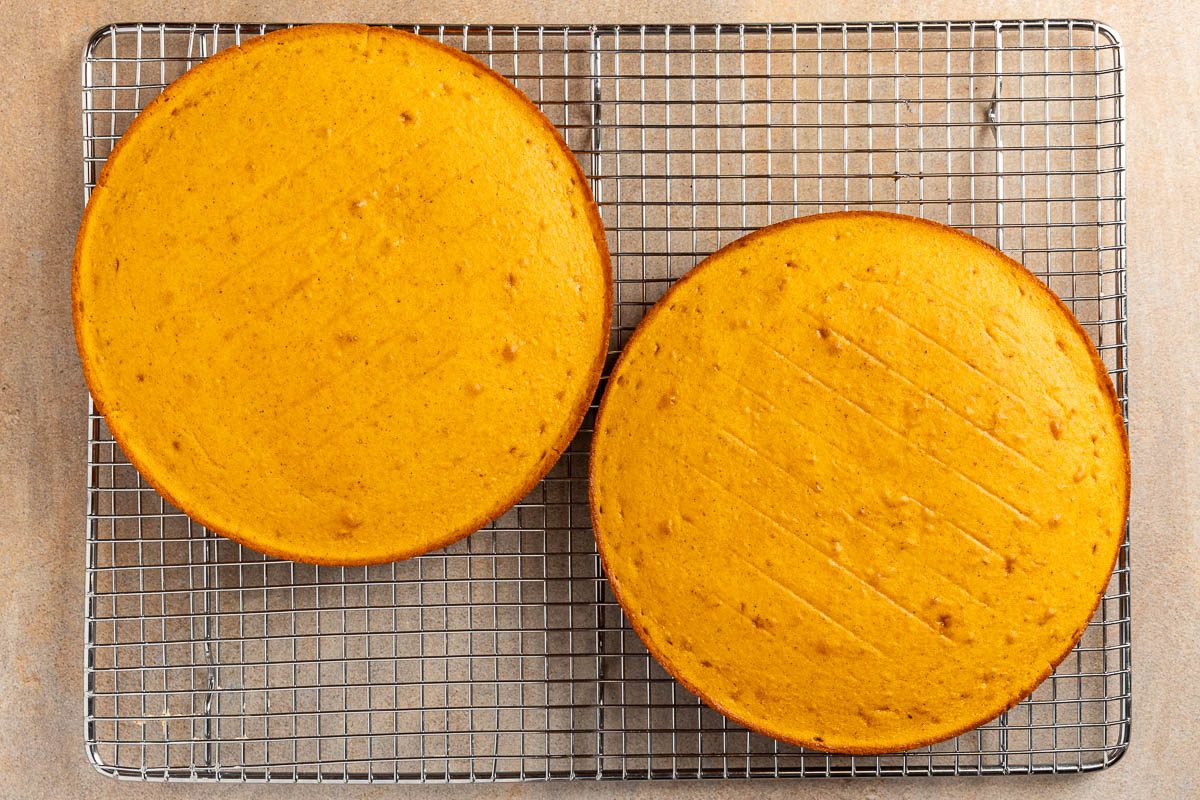 Taste of Home Pumpkin Pie Cake recipe photo of the baked cake on a cooling rack.