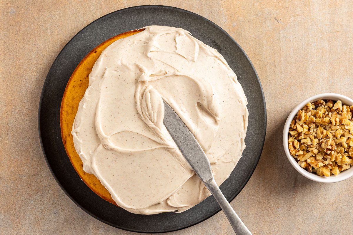 Taste of Home Pumpkin Pie Cake recipe photo of the assembled and frosted cake.