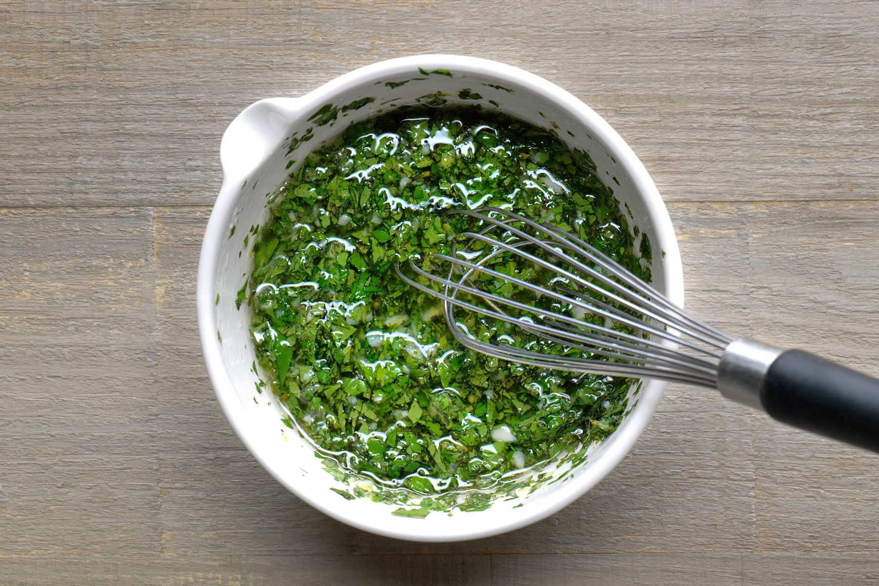 Olive oil, lemon zest, lemon juice, garlic, parsley, mint and salt whisked in a small bowl.