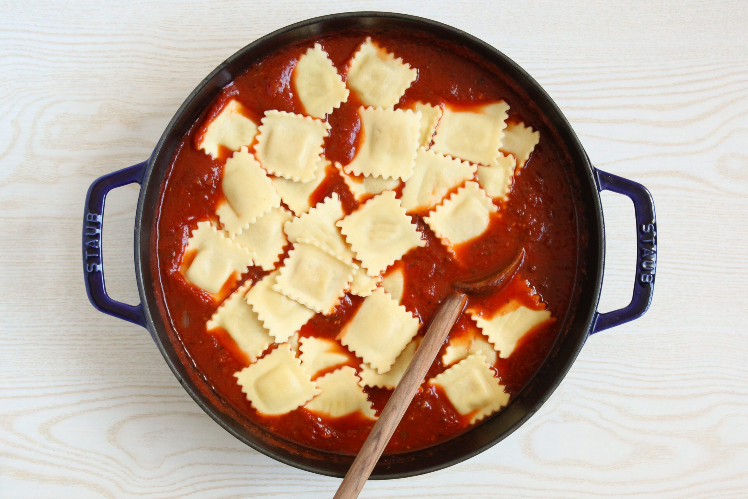 Adding ravioli to soup