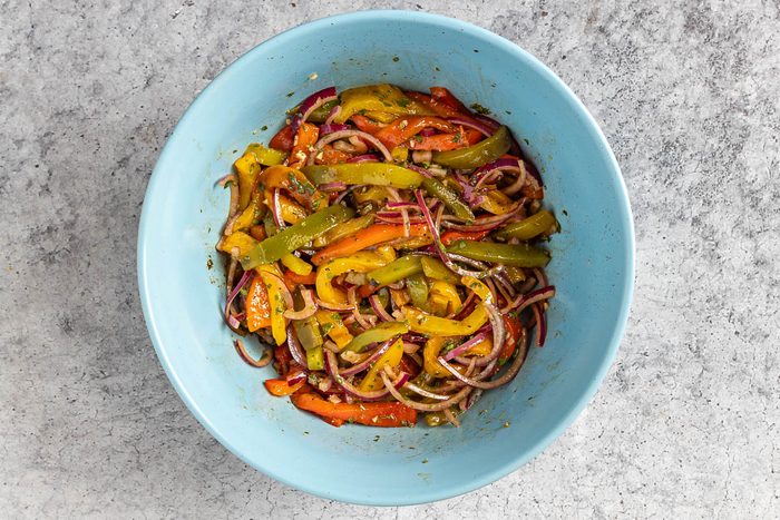 Taste of Home Roasted Pepper Salad photo of the vinaigrette added to salad.