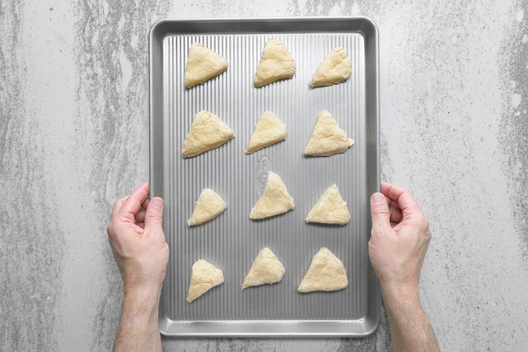Dough wedges placed 1 inch apart on an ungreased baking sheet.