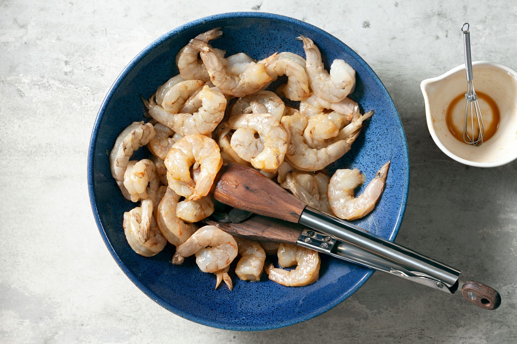 Whisk together 1 tablespoon soy sauce and 2 teaspoons wine with cornstarch and pepper then add shrimp and toss to coat