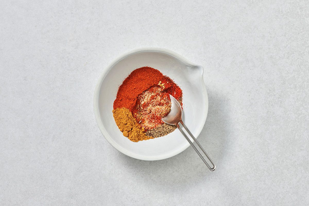 Ingredients for taco seasoning in a bowl before being mixed