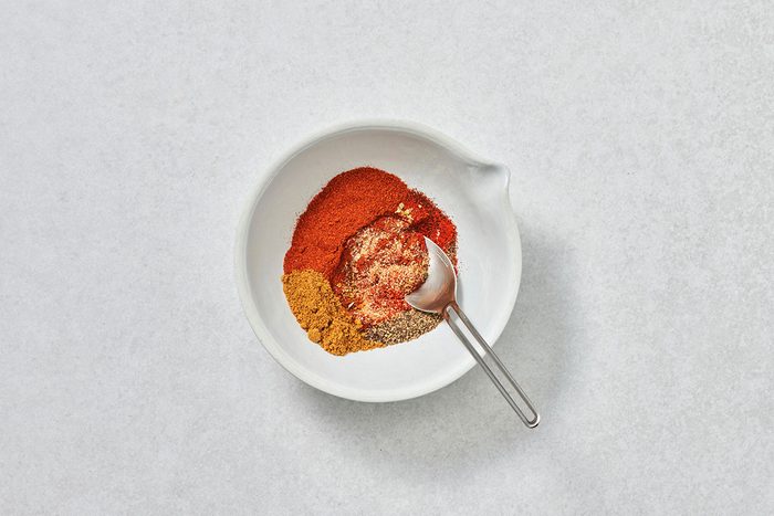 Ingredients for taco seasoning in a bowl before being mixed