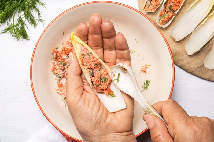 filling the endive leaves with the Smoked Salmon Mousse