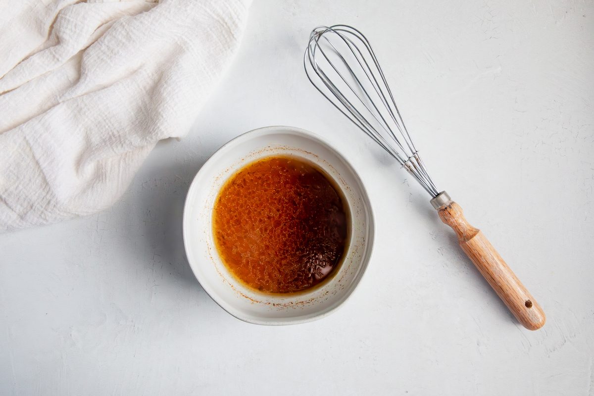 Overhead shot for Taste of Home Southwest Chicken Salad, salad dressing in a small bowl.