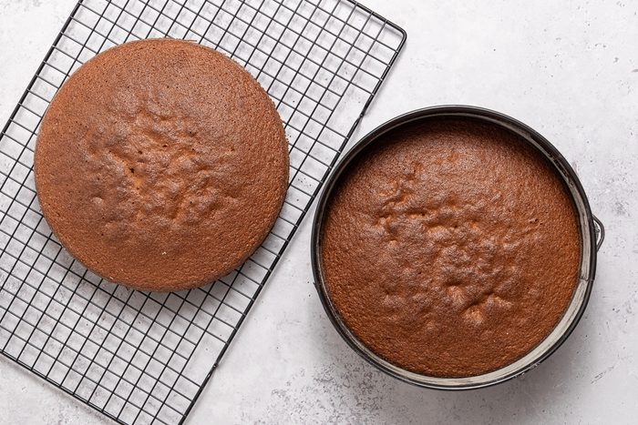 Cakes In Baking Pan And On Cooling Rack