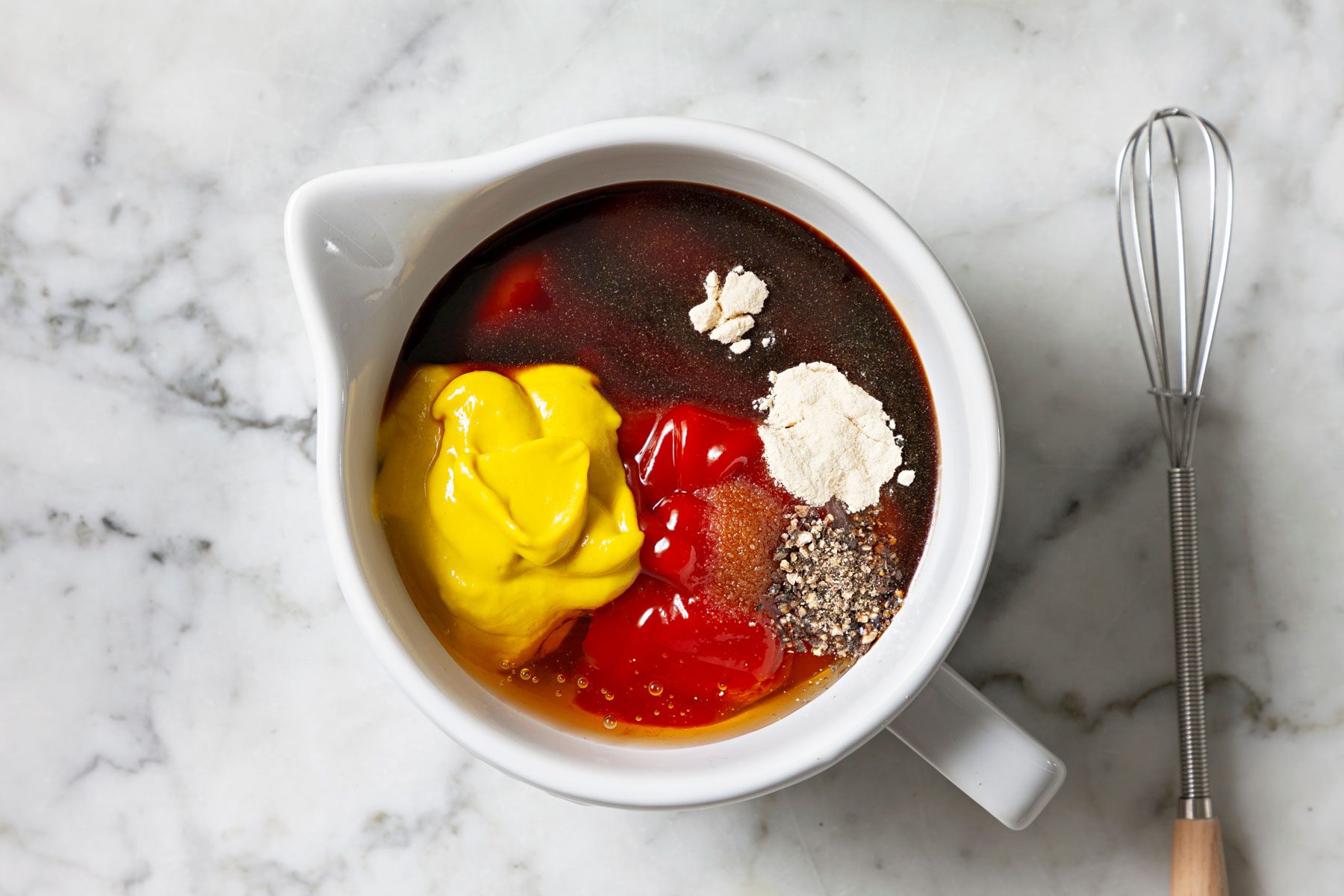 Sauce ingredients in a large container.