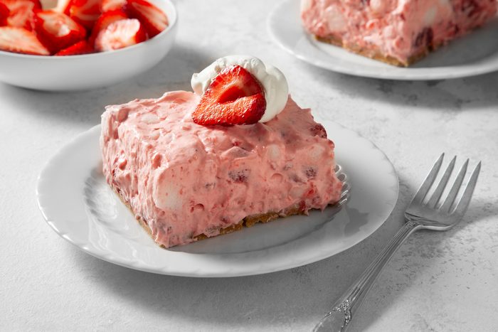 3/4th shot of strawberry delight topeed with strawberry and whipped cream