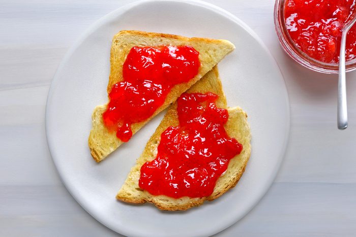 Strawberry Jam spread on slice of bread