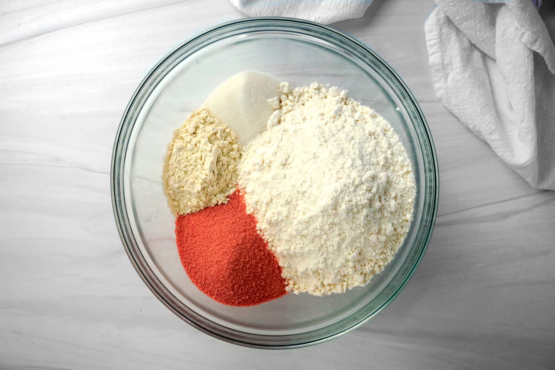 Combining Cake mix; Gelatin; Sugar and Flour in a bowl