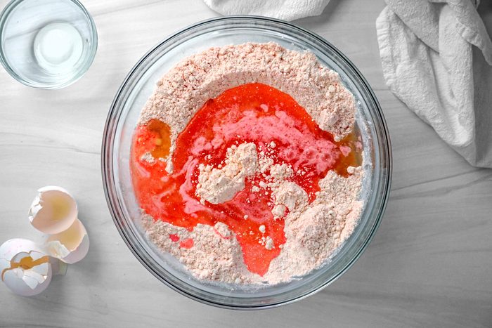 Adding Water; Oil and Eggs into the flour mixture