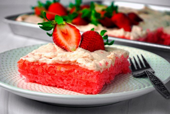 Strawberry Sheet Cake piece in a plate with fork