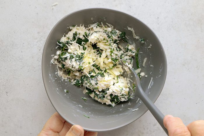overhead shot of cheese mixture in a grey bowl