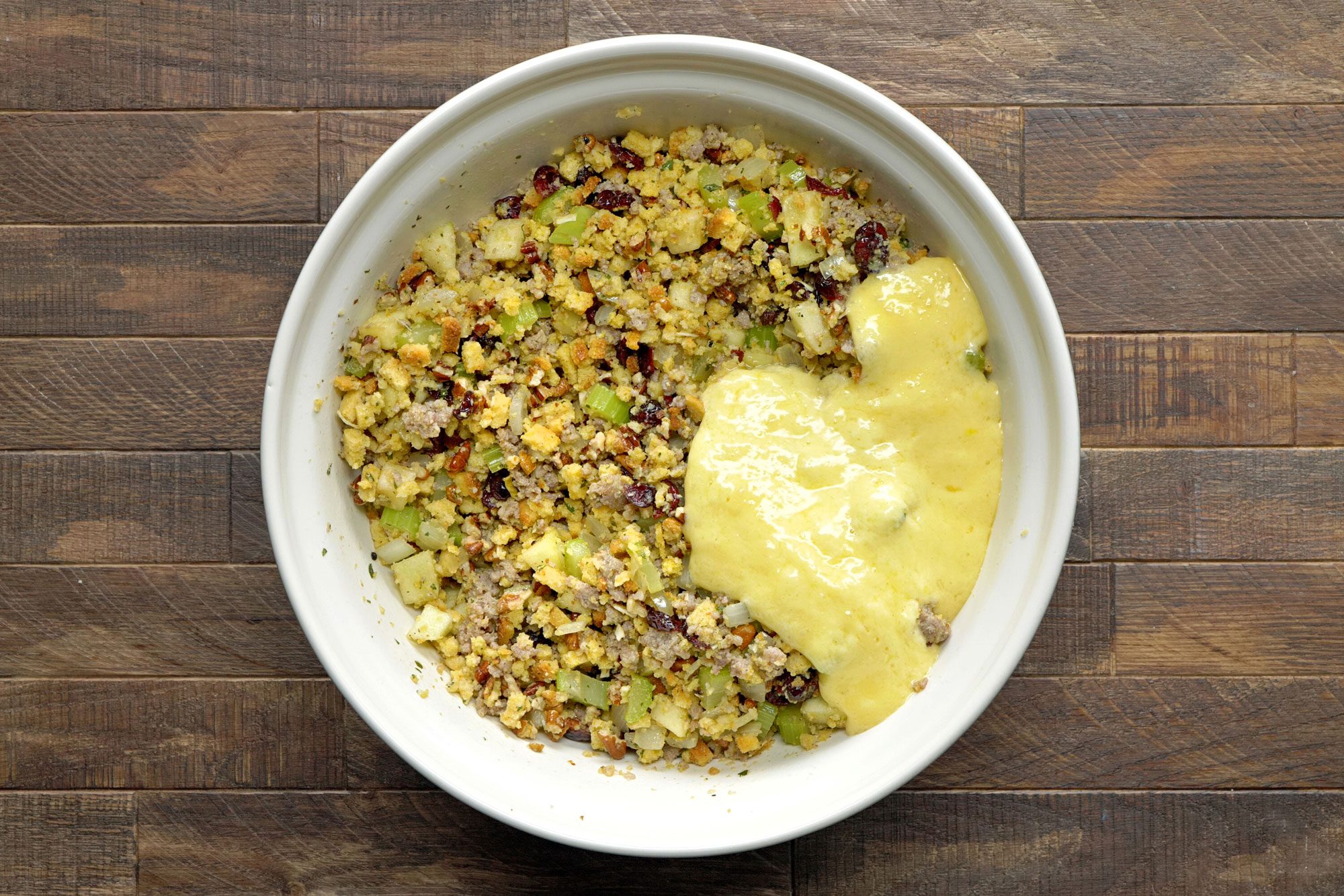 Whisk eggs and baking powder; add to stuffing mixture; Wooden Background;