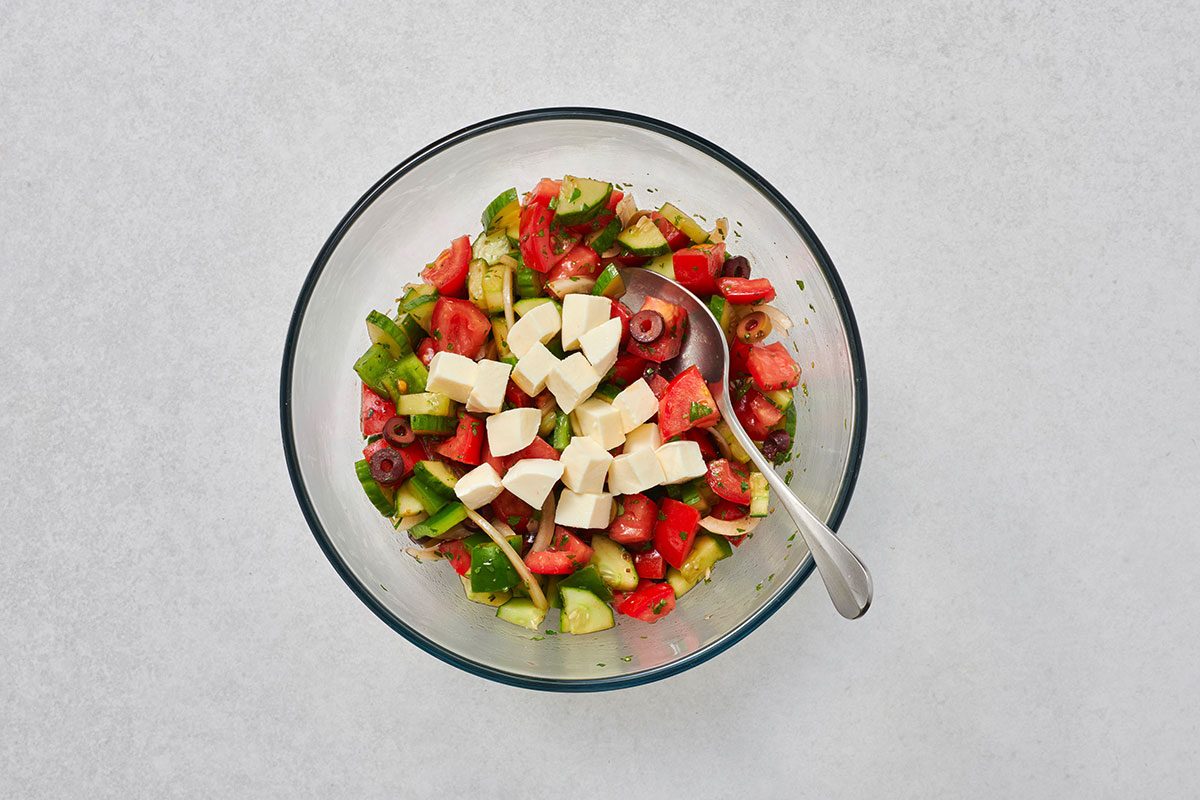 Cheese tossed into the salad before serving