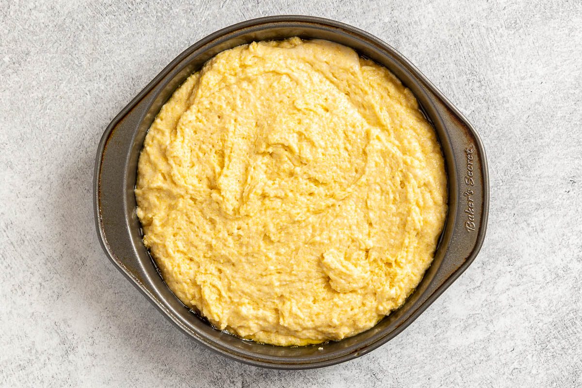 batter in a cake pan.