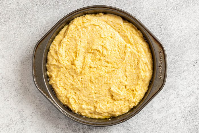 batter in a cake pan.