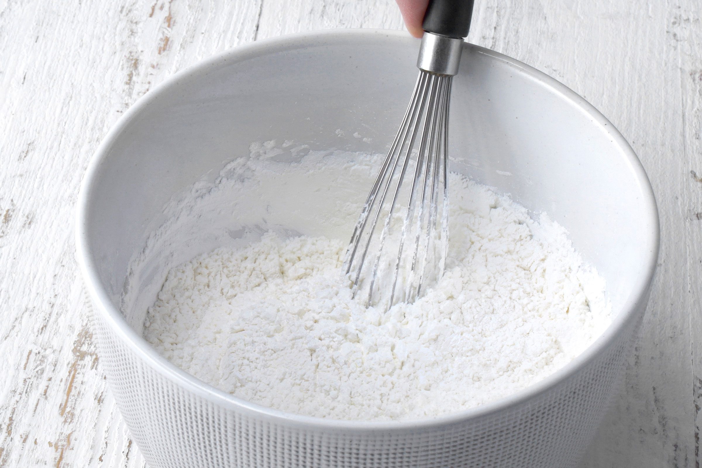 Flour, cornstarch, baking powder, baking soda and salt whisked together in a bowl