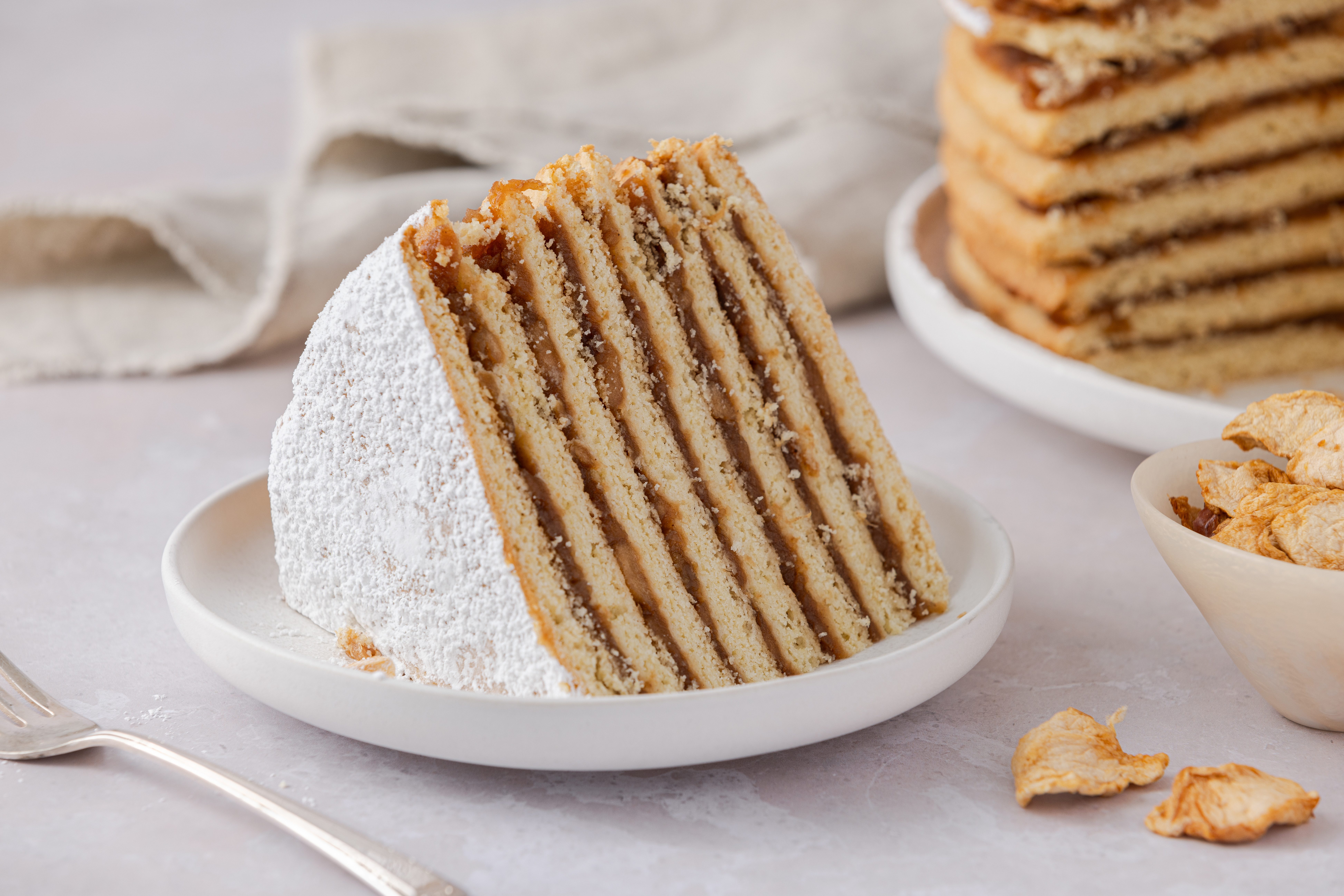Apple stack cake slice on small plate.