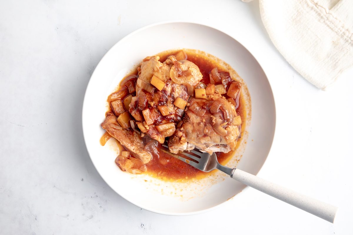 Overhead beauty shot for Taste of Home Apple Chicken being served in a bowl.
