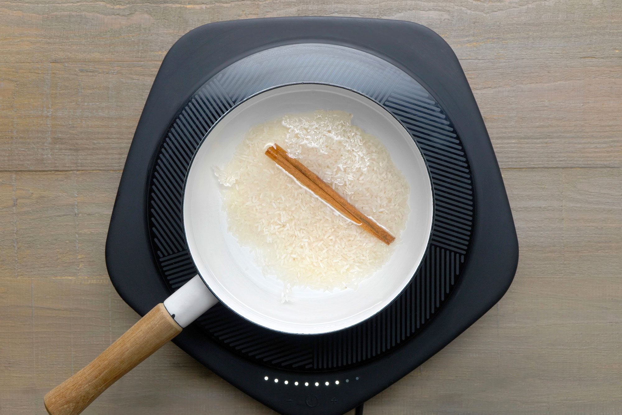 In a small saucepan, combine the water, rice and cinnamon. Bring to a boil.