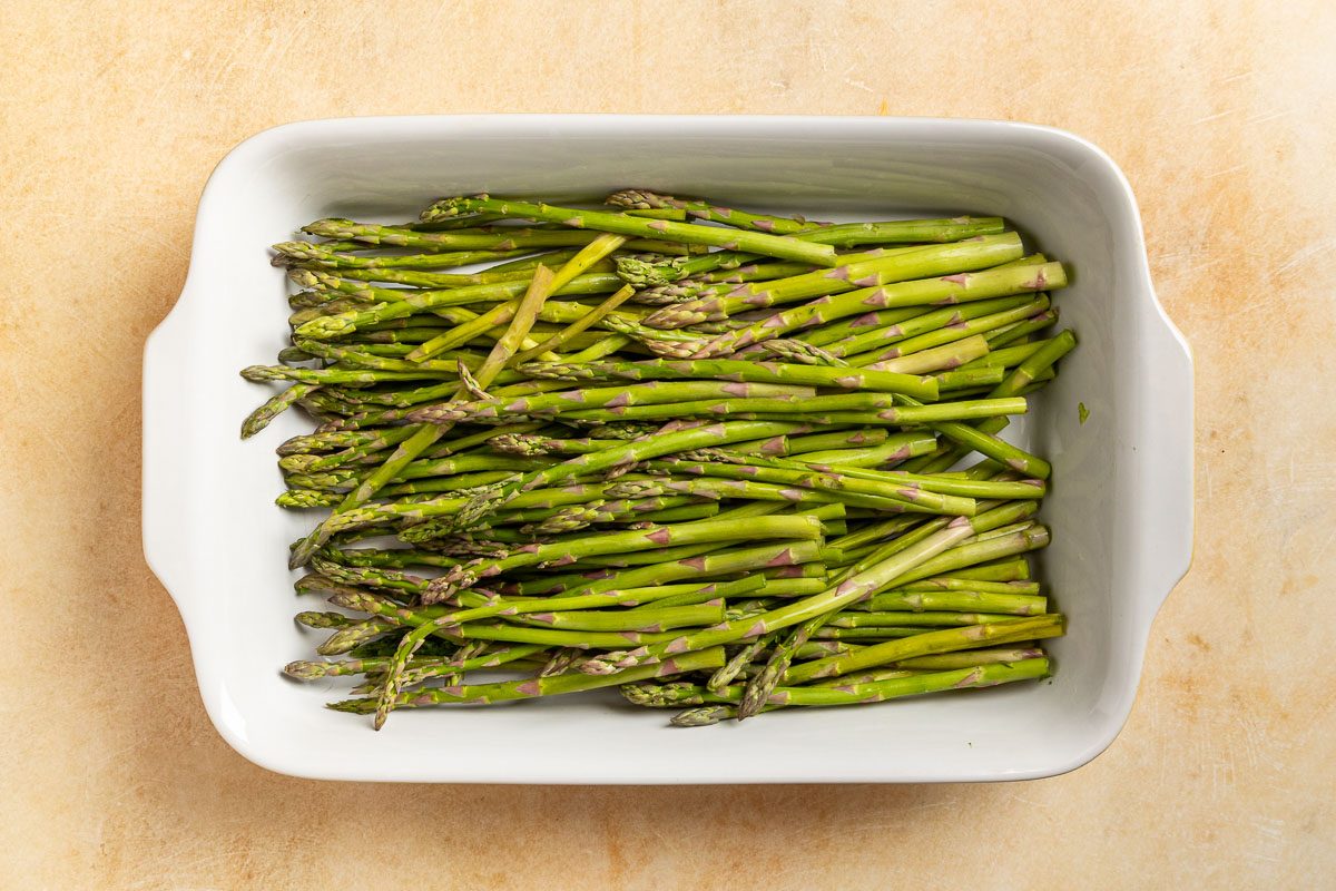 Taste of Home Asapargus Casserole photo of the trimmed asparagus in a baking dish.