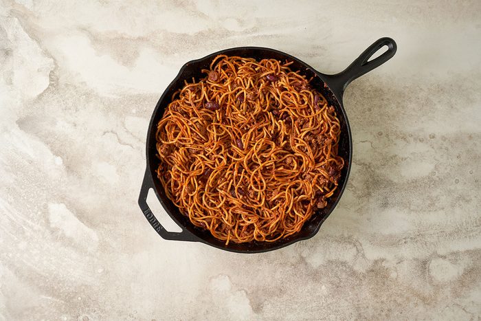 Cover and bake the Baked Chili Spaghetti for 65 to 70 minutes until the spaghetti is tender, then let it stand for 10 minutes before serving, by Taste of Home.