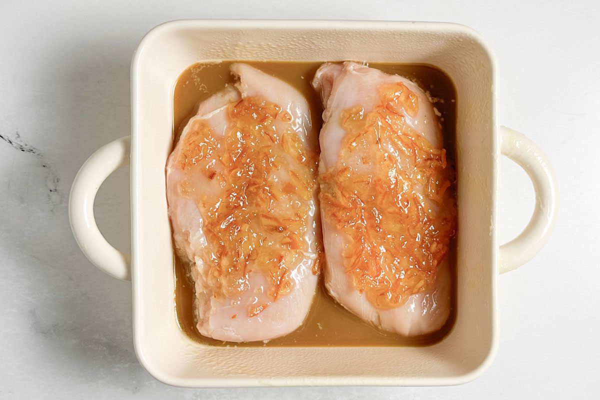 Unbaked Taste of Home Baked Orange Chicken in a ceramic baking dish