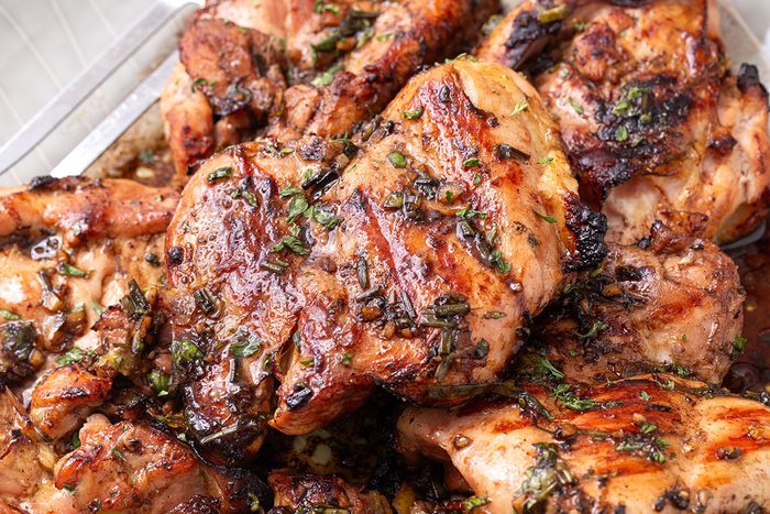 Balsamic Chicken on a serving platter topped with chopped parsley or Taste of Home