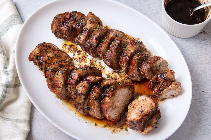 Plated and sliced Balsamic Pork Tenderloin coated with balsamic glaze for Taste of Home