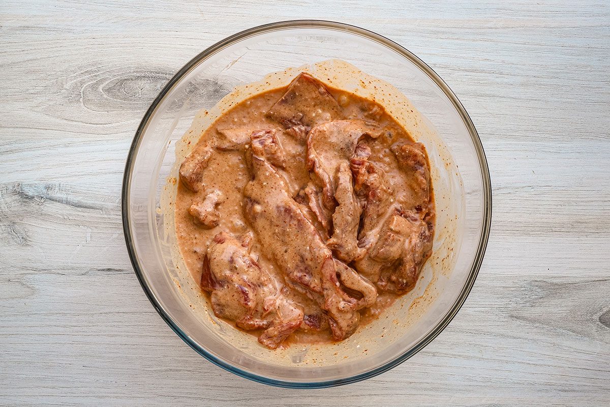 Marinating strips of skirt steak for a beef satay recipe, from Taste of Home.