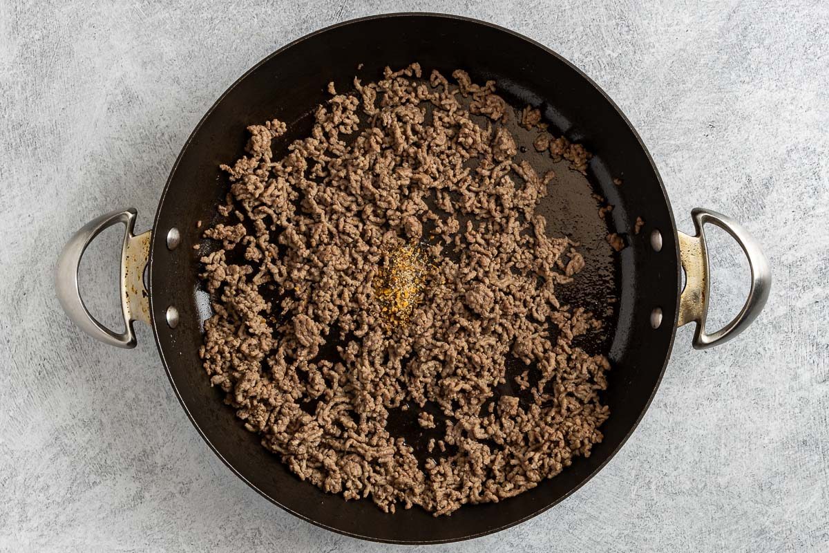 Taste of Home Beef Tortellini photo of the cooked ground beef with Montreal Steak seasoning added to the skillet.