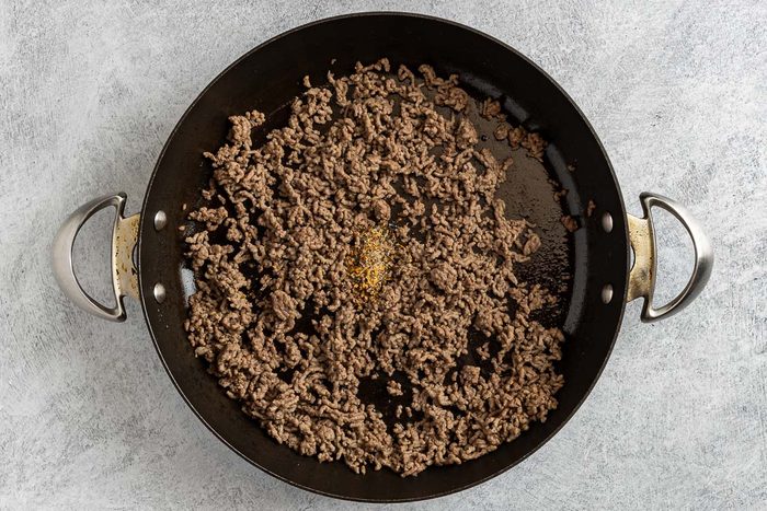 Taste of Home Beef Tortellini photo of the cooked ground beef with Montreal Steak seasoning added to the skillet.