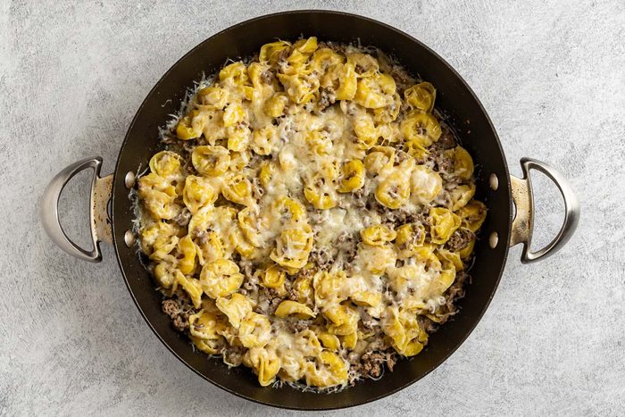 Taste of Home Beef Tortellini photo of melted Italian cheese blend on top of the beef torellini.