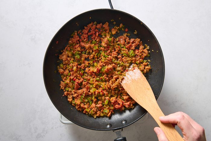 Cooking the chorizo and peppers in a skillet