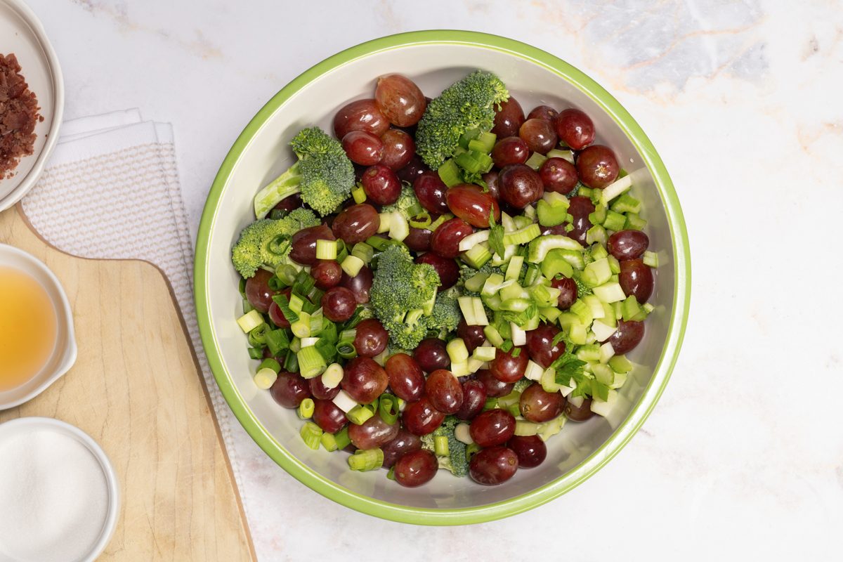 mixing the ingredients for the Broccoli Grape Salad