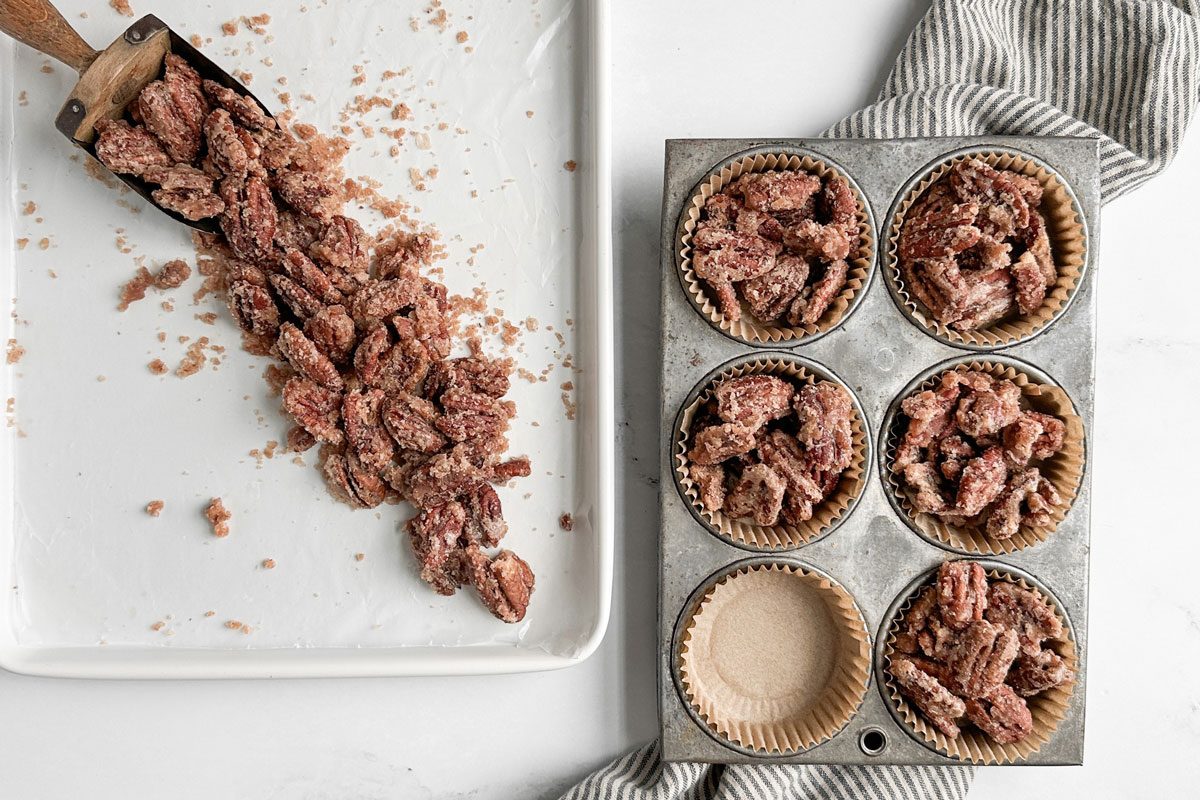 Taste of Home Candied Pecans in a vintage muffin tin and on a white baking sheet