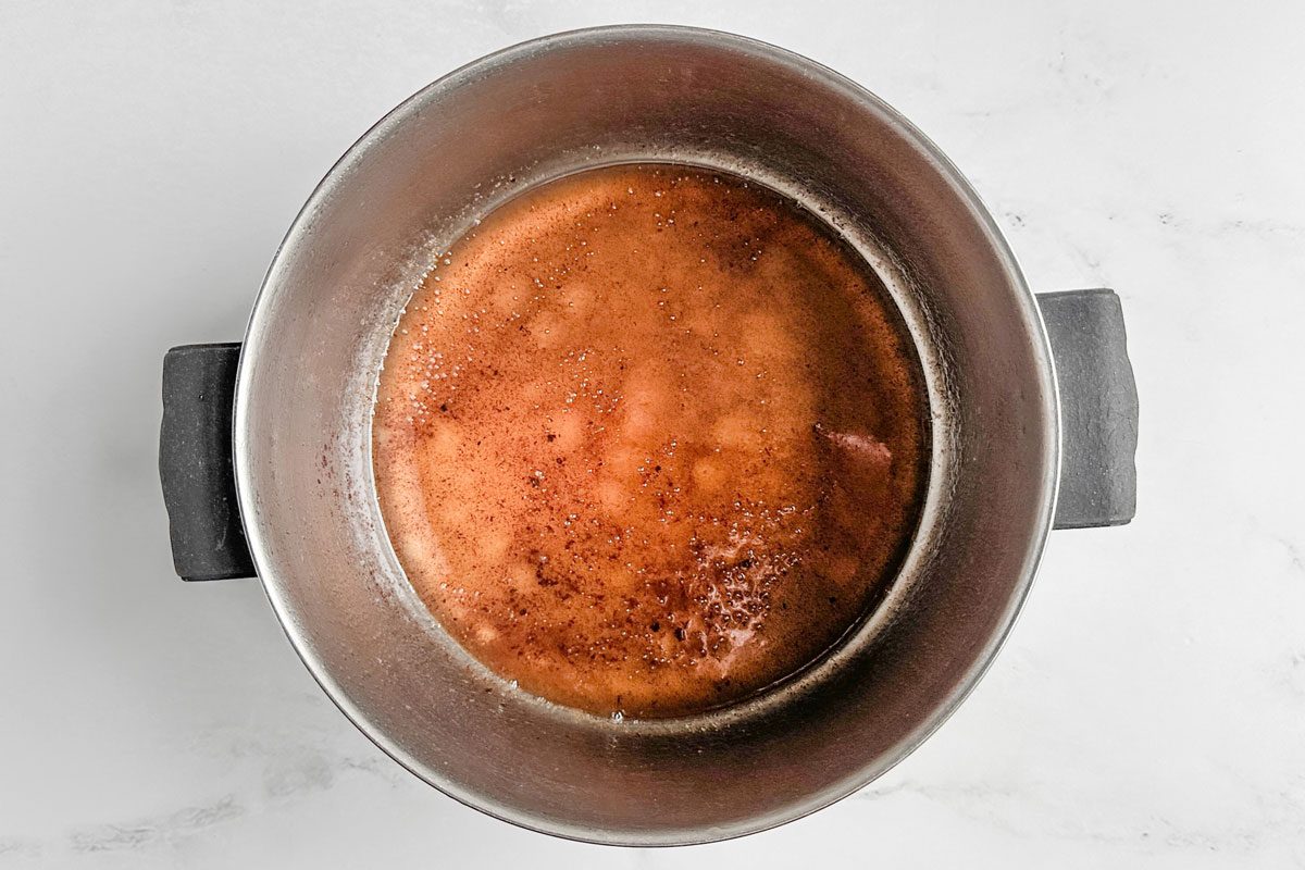 Sugar syrup for Taste of Home Candied Pecans in a saucepan