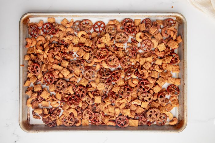 Overhead shot for Taste of Home Caramel Chex Mix, after being baked on a parchment lined baking sheet.