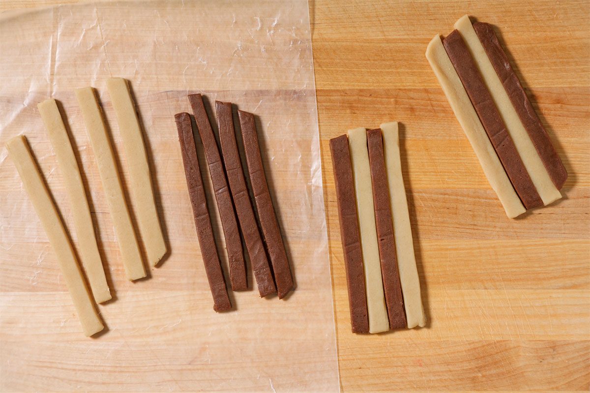 Stack the strips in groups of 4, alternating plain and chocolate strips and forming 8 separate stacks.
