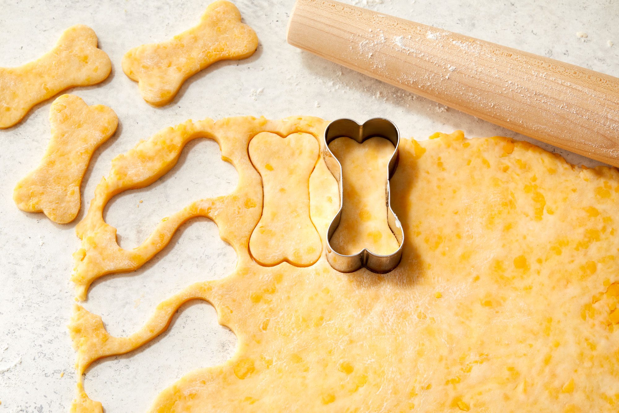 Roll dough into a 12x9 inch rectangle and cut with bone shaped cutter