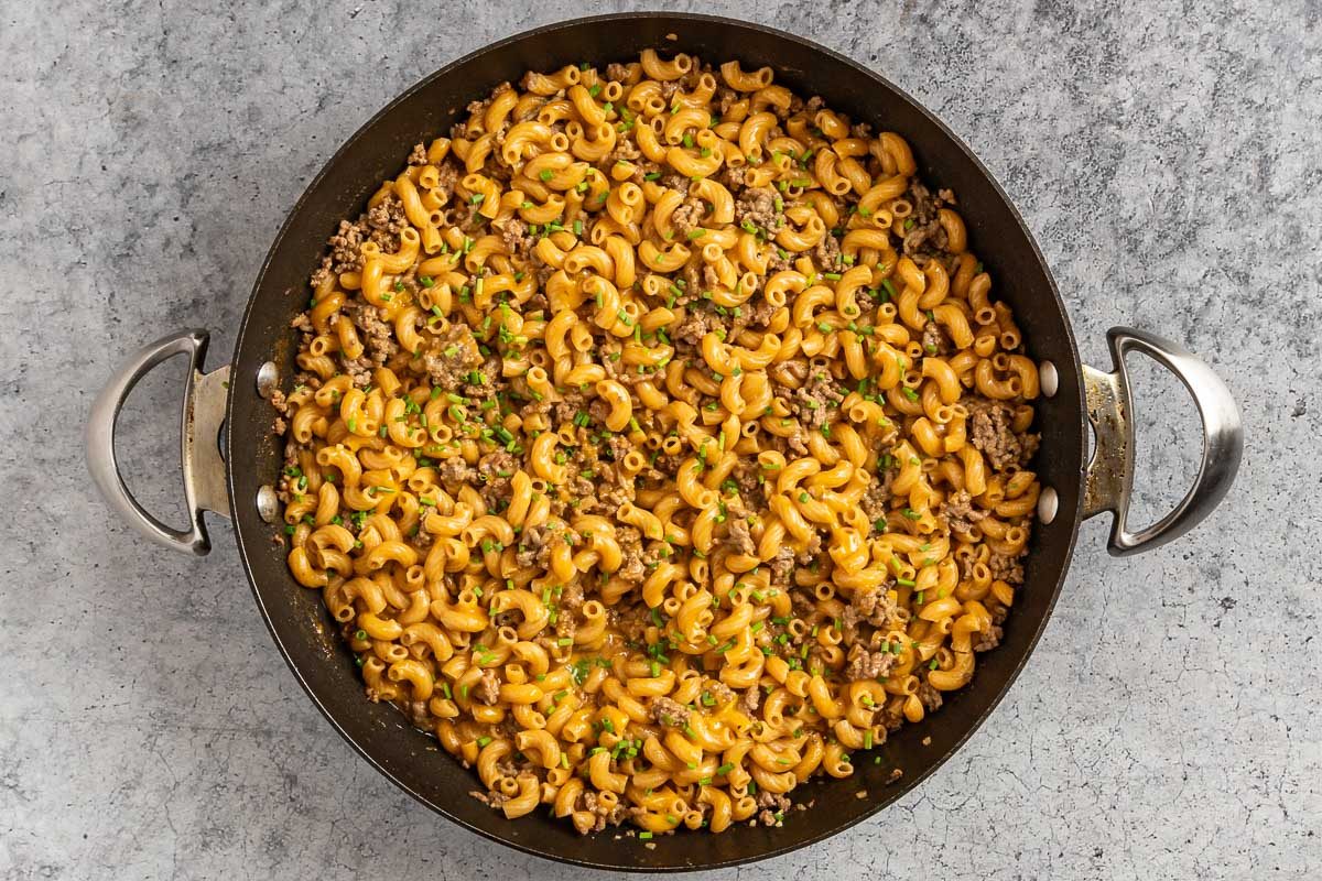 Taste of Home Cheeseburger Macaroni photo of the rest of the ingredients, minus the chives, added to the skillet and cooked for 15 minutes.