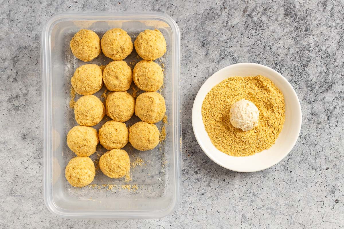 rolling the cheesecake balls in graham cracker crumbs.