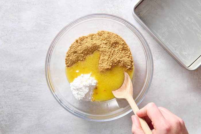 Combining the crust ingredients in a large bowl