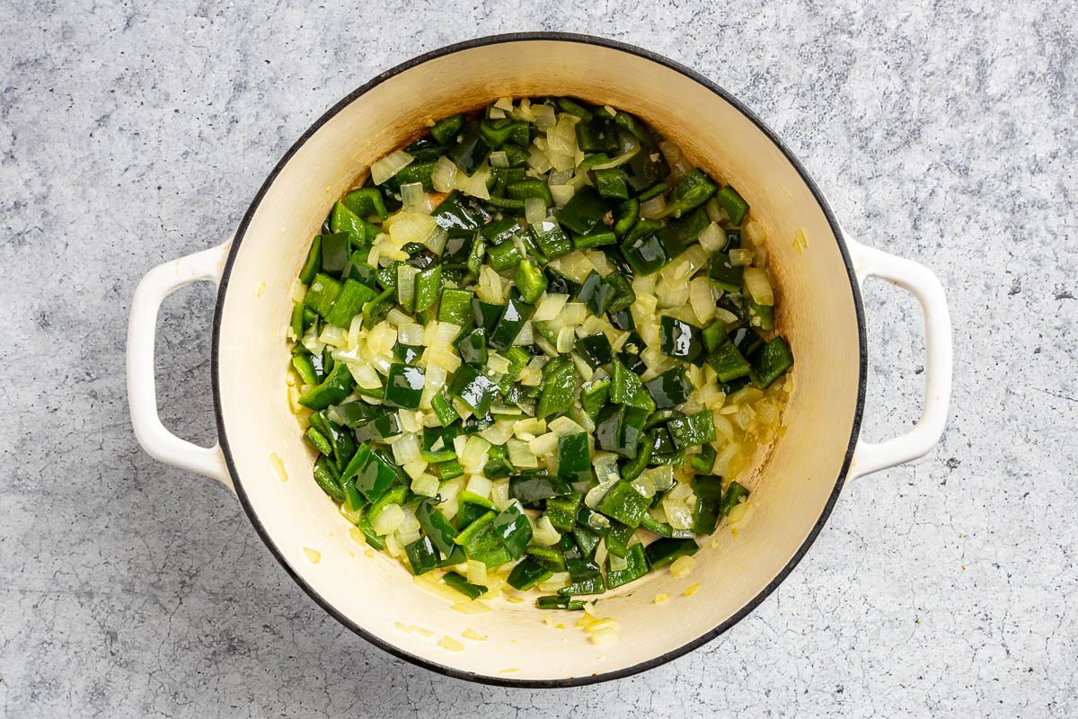 Taste of Home Chicken Poblano Soup photo of the sauteed onion, poblano peppers and garlic in a Dutch oven.